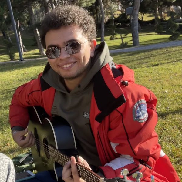 Ömer Faruk playing guitar